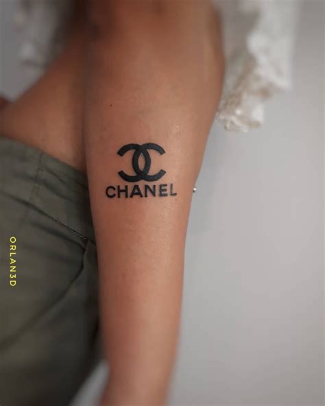 chanel finger tattoo